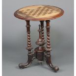 A Victorian circular inlaid mahogany table, the top inlaid a chessboard, raised on 3 spiral turned