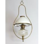 A glass and gilt metal hanging oil lamp with opaque glass shade 59cm h x 30cm Crack to reservoir