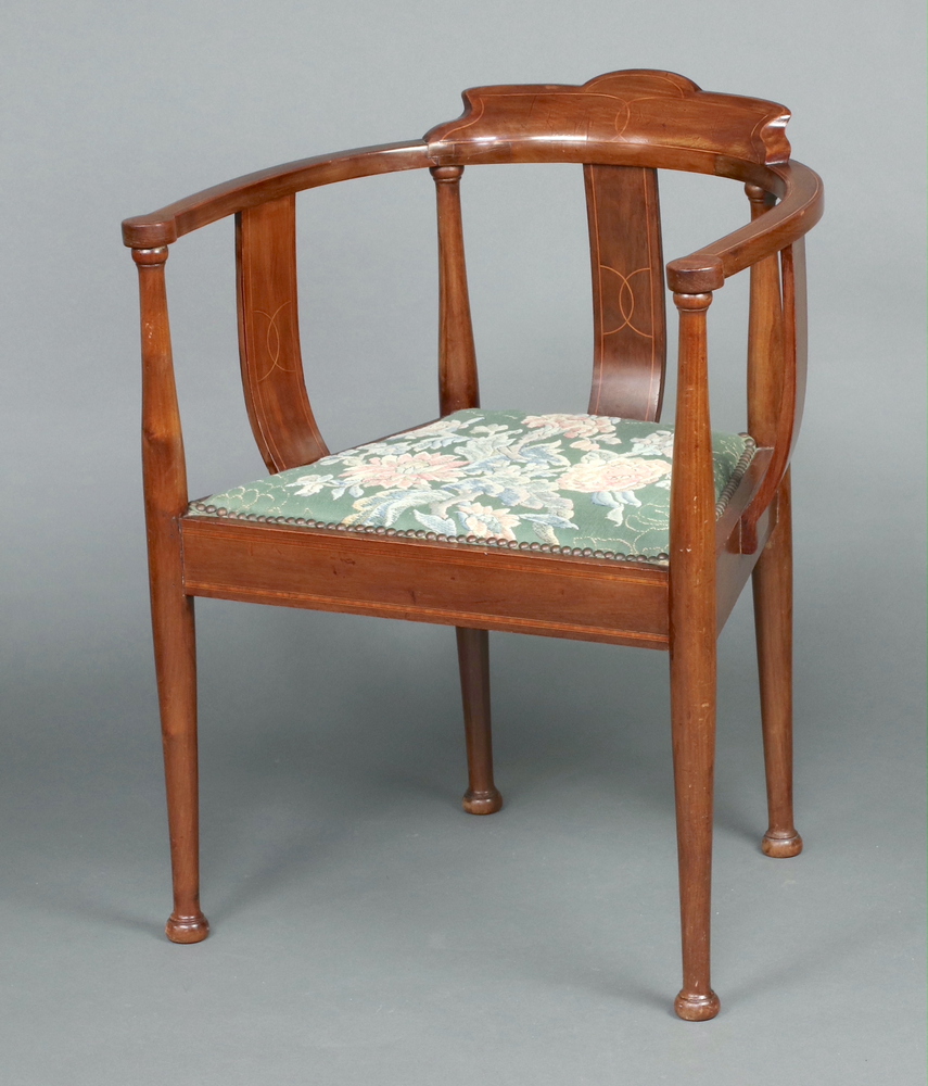An Edwardian Art Nouveau inlaid mahogany tub back and splat back chair with upholstered seat, raised