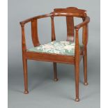 An Edwardian Art Nouveau inlaid mahogany tub back and splat back chair with upholstered seat, raised