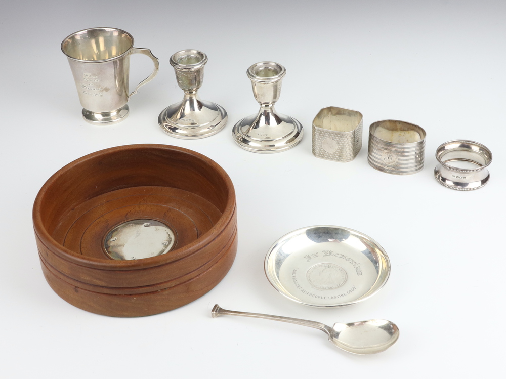 A silver Art Deco cup Chester 1939, 3 napkin rings, a spoon, pin dish, dwarf candlesticks and a