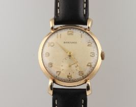 A gentleman's 9ct yellow gold Garrard wristwatch with seconds at 6 o'clock in a 32mm case numbered