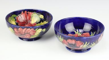 A circular William Moorcroft blue glazed bowl decorated anemones (f and r) 16cm, base impressed