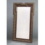 A 19th Century rectangular bevelled plate mirror contained in a decorative gilt frame 100cm h x 74cm