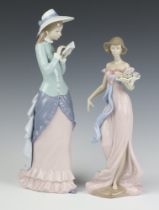 A Lladro figure - Spring Flirtation 32cm and 1 other Reading 36cm, both boxed The figure "Spring