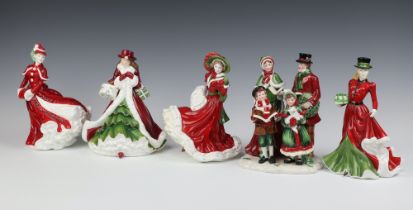 Four Royal Doulton Christmas Day figures 2003, 2005, 2006 and 2010 together with a pottery figure