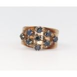 A yellow metal 14k sapphire 5 section ring 4.3 grams, size K