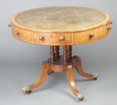 A Georgian mahogany drum table with revolving inlaid and green leather writing surface, fitted 4
