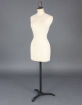 A Stockman mannequin "Maude" raised on an iron base marked Stockman London 150cm h x 36cm w x 19cm d