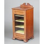 An Edwardian inlaid and crossbanded mahogany music cabinet with raised back, fitted shelves enclosed