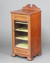 An Edwardian inlaid and crossbanded mahogany music cabinet with raised back, fitted shelves enclosed