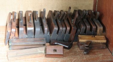 Sixteen 19th Century wooden moulding planes together with 3 smaller planes