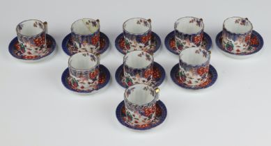 Nine Chinese miniature porcelain coffee cans and saucers with figural decoration, the bases with 6