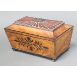 A William IV rectangular inlaid mahogany twin compartment tea caddy with hinged lid raised on bun