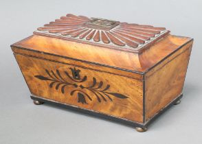 A William IV rectangular inlaid mahogany twin compartment tea caddy with hinged lid raised on bun