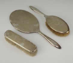 A silver handled clothes brush Birmingham 1917 together with a Sterling silver backed hand mirror