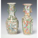A 19th Century Canton famille rose club shaped vase with panel decoration of figures 26cm (
