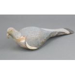 A 19th Century wooden painted decoy pigeon with glass eye 38cm x 10cm One glass eye is missing,