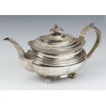 A George III oval silver teapot raised on bun feet Newcastle 1798 by James Bell 683 grams