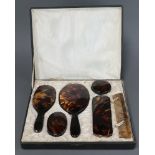 A 1930's 6 piece simulated tortoiseshell dressing table set comprising hand mirror, hair brush, 2