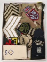 A collection of military rank slides, stripes, cloth insignia