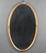 A 19th Century rectangular bevelled plate wall mirror contained in a gilt plaster ribbon frame