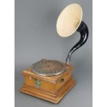 A manual horn gramophone with oak case and associated horn, the base labelled Les Disques Pathe