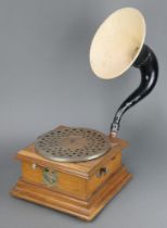 A manual horn gramophone with oak case and associated horn, the base labelled Les Disques Pathe