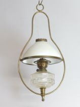 A glass and gilt metal hanging oil lamp with opaque glass shade 59cm h x 30cm Crack to reservoir