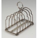 A silver 7 bar toast rack on bun feet, Birmingham 1940, 180 grams