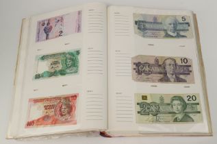 A quantity of World bank notes contained in an album
