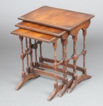 A nest of 3 Georgian style rectangular mahogany coffee tables, raised on turned and block supports