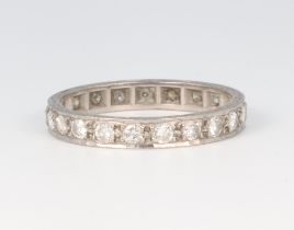 A white metal 18ct full eternity ring set diamonds, each diamond approx. 0.4ct, size Q, 3.2 grams