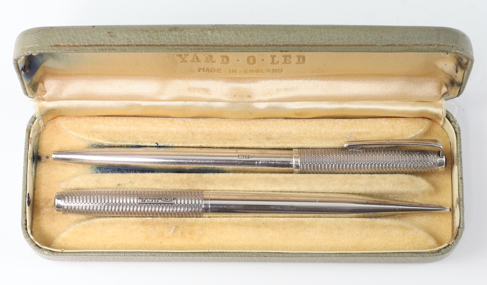 A Yard O Led propelling pencil and ditto ballpoint pen contained in silver cases, Birmingham 1961,