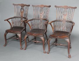 A set of 3 18/19th Century Windsor elm and beech stick and bar back carver chairs with saddle seats,