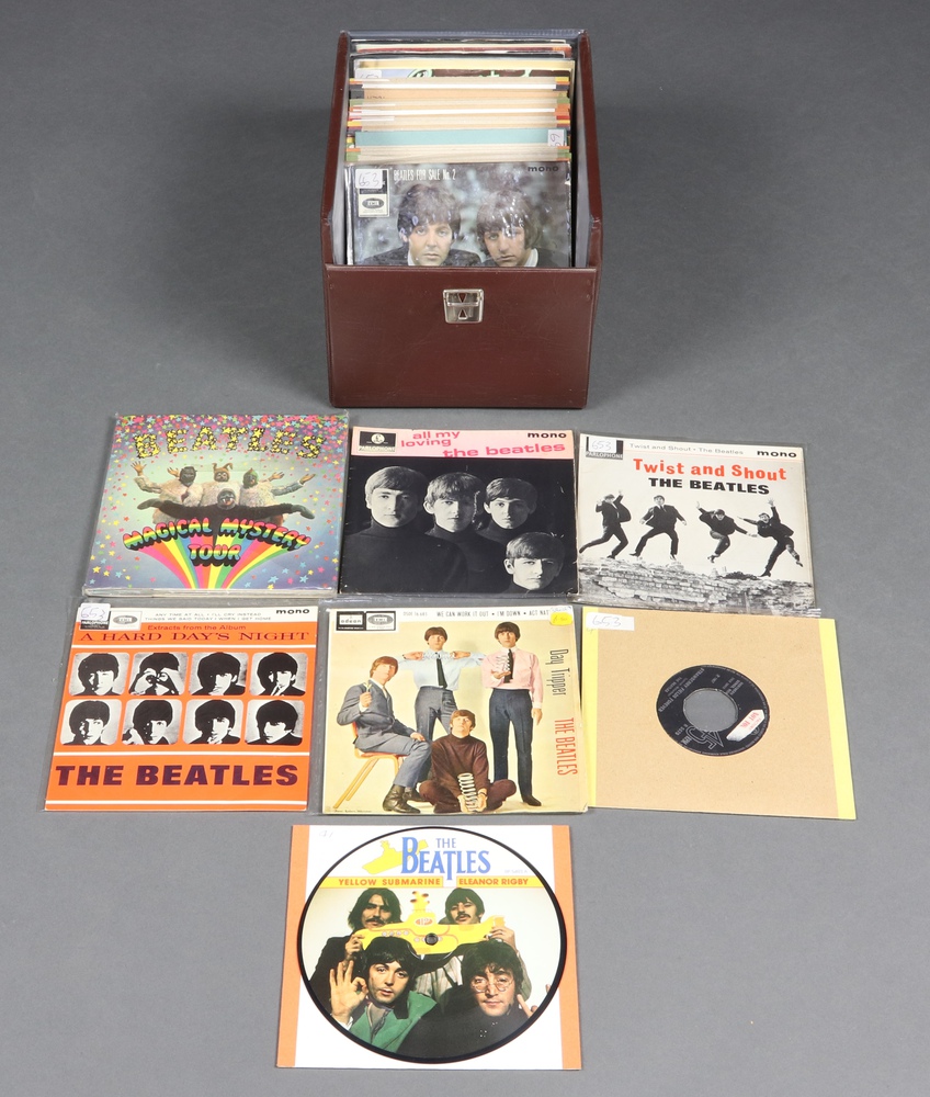 The Beatles, a collection of 44 7 inch 45rpm vinyl single records, mix of reproduction and originals