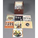 The Beatles, a collection of 44 7 inch 45rpm vinyl single records, mix of reproduction and originals