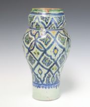 An Ismic pottery vase of waisted form the base with signature 35cm The vase has been riveted and has