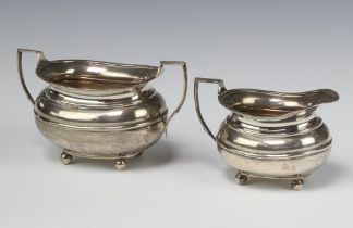 A silver Georgian style silver cream jug Sheffield 1904 and 1 other cream jug Sheffield 1915, 456