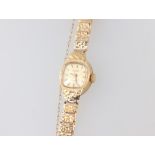 A lady's Evite wristwatch contained in a 9ct gold case with integral bracelet, 8.8 grams including a