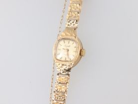 A lady's Evite wristwatch contained in a 9ct gold case with integral bracelet, 8.8 grams including a