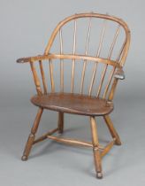 A 19th Century beech and elm stick and rail back carver chair, raised on turned supports with H