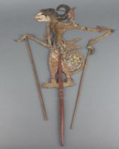 A 19th/20th Century Indonesian pierced puppet with articulated limbs 41cm x 27cm