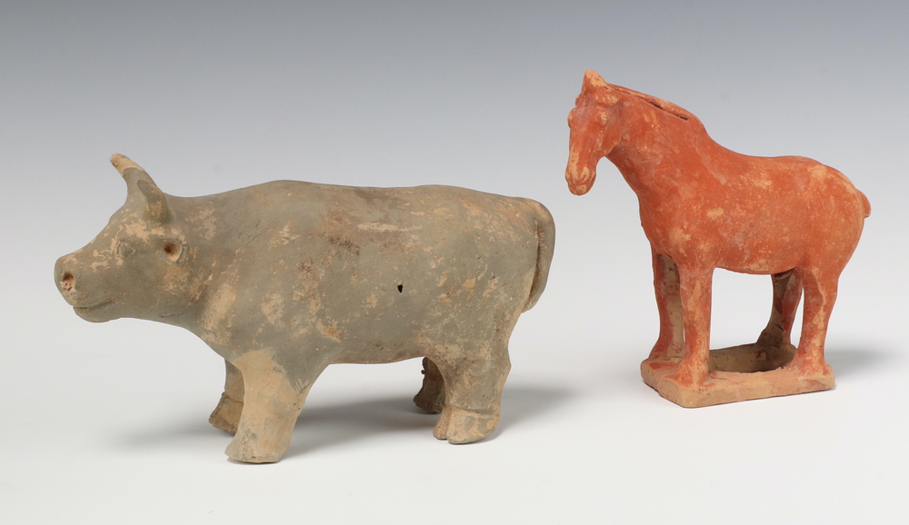 A pottery figure of a standing cow 12cm x 23cm (some chips to horns and ears) and a ditto Tang horse