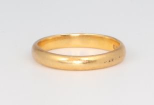 A 22ct yellow gold wedding band, size J, 3.2 grams