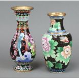 A Japanese black ground cloisonne enamel waisted club shaped vase decorated a bird on a circular