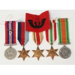 A group of Second World War medals comprising 1939-45 Star, Africa Star, Italy Star, Defence and War