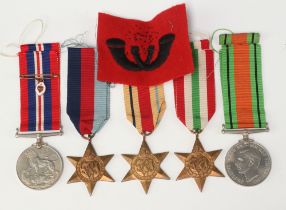 A group of Second World War medals comprising 1939-45 Star, Africa Star, Italy Star, Defence and War