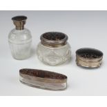 A circular cut glass dressing table jar with silver and tortoiseshell lid, London (marks rubbed)