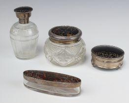 A circular cut glass dressing table jar with silver and tortoiseshell lid, London (marks rubbed)